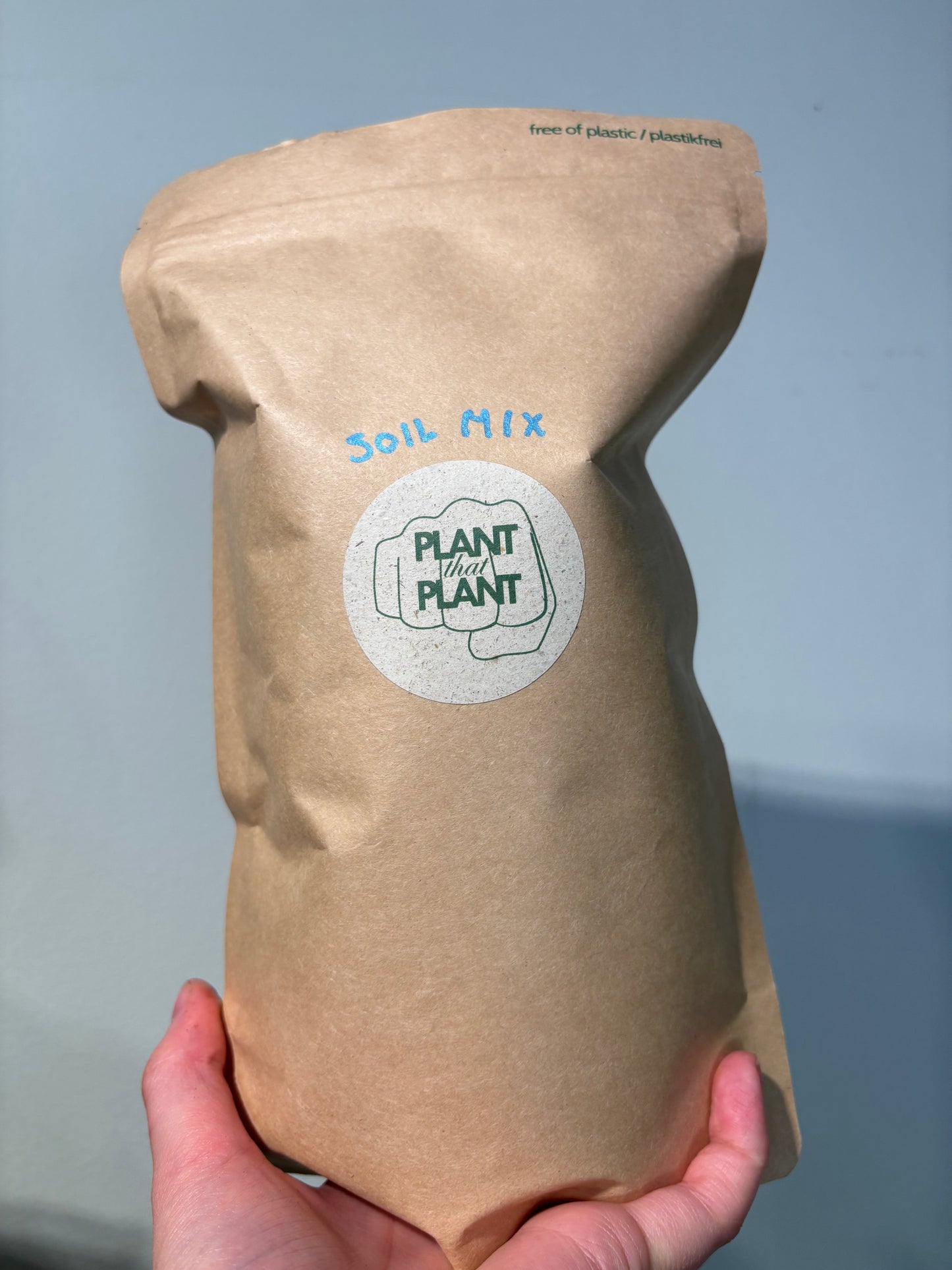 Eco-friendly kraft paper bag labeled 'Plant That Plant' containing Home made Aroid Soil Mix ideal for aroid plant growth and drainage.