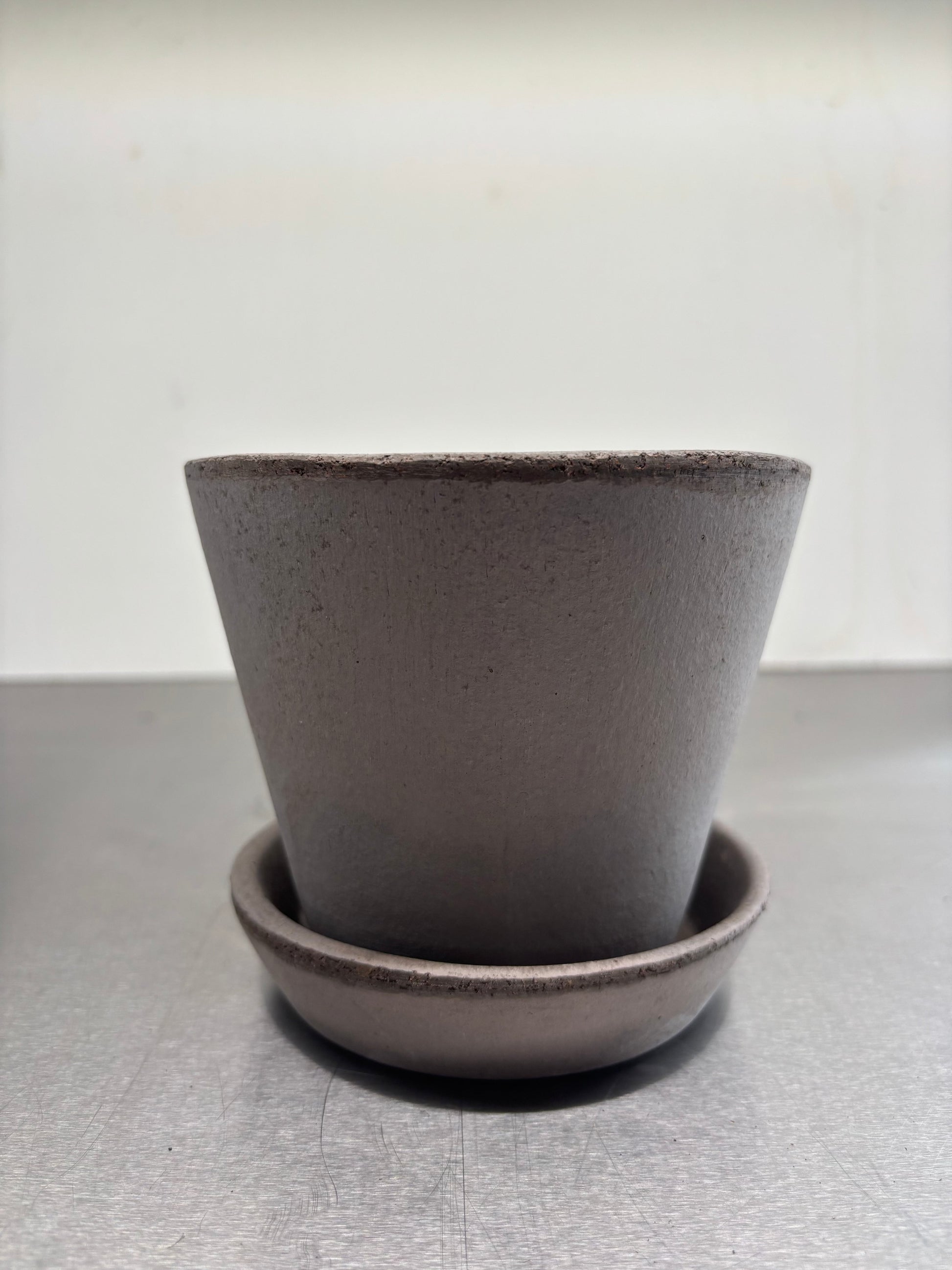 Bergs Clay pots, 11.5x12.5 cm in minimalist design, handcrafted from Italian terracotta with matching saucer for stylish plant display.