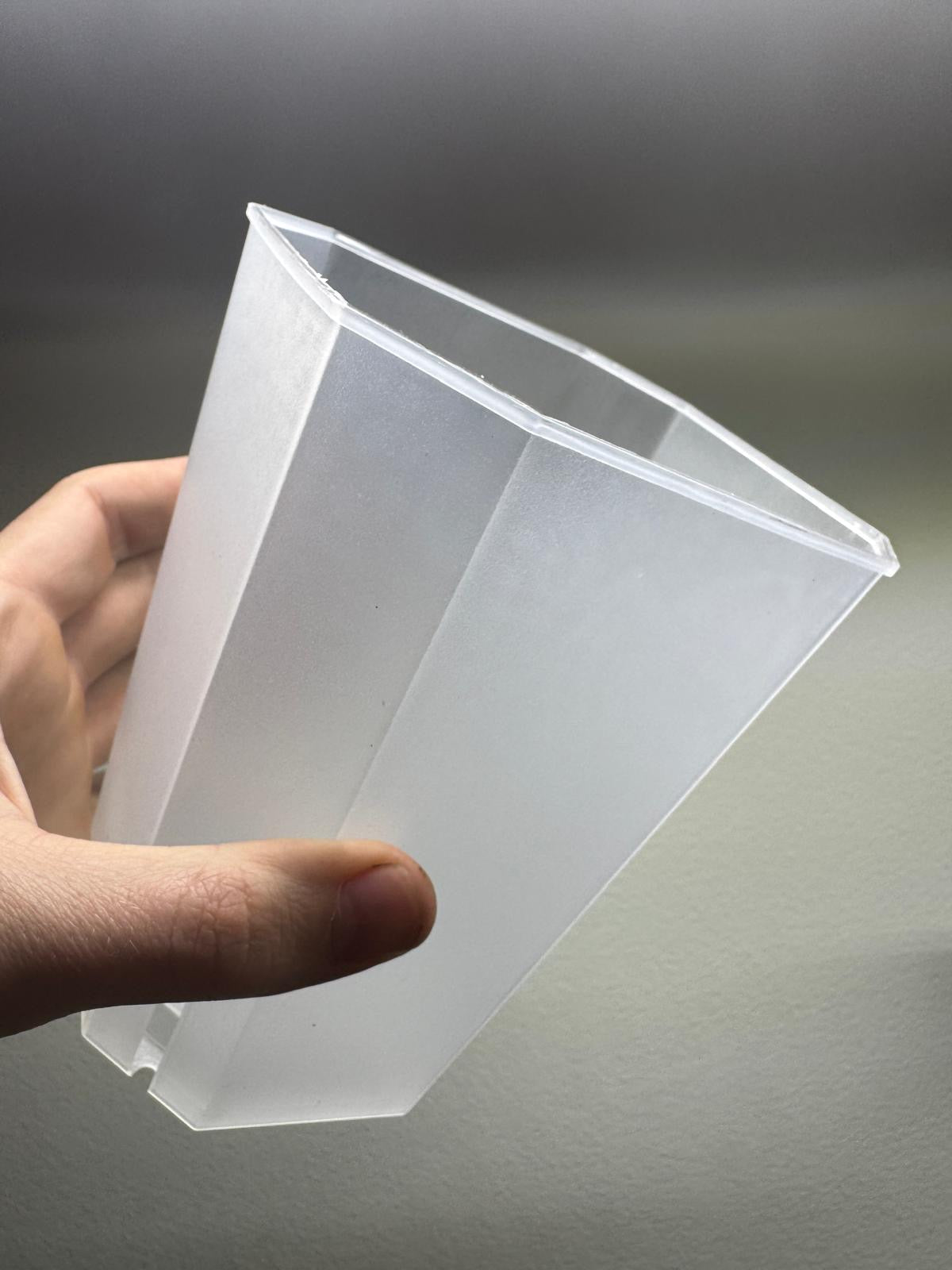 Angled view of 17x12cm clear planter pot, highlighting its tapered shape and translucent walls for optimal root visibility.